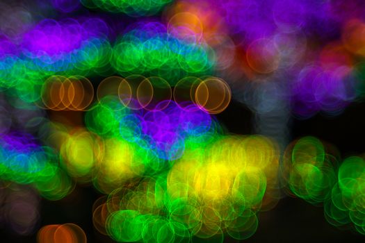 Festive Christmas elegant abstract background with bubble bokeh lights. Background with defocused lights. Neon color. Copy space.