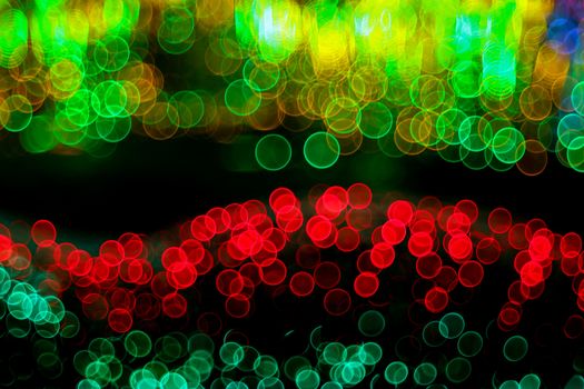 Festive Christmas background. Abstract twinkled bright background with bokeh defocused lights. Unique bokeh effect.