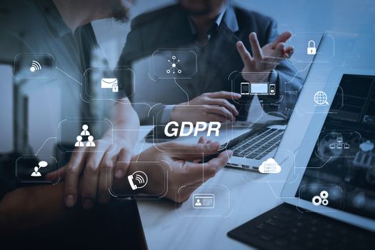 GDPR. Data Protection Regulation with Cyber security and privacy virtual diagram.Business team meeting. Photo professional investor working new start up project. Finance task.Digital tablet docking keyboard laptop computer.