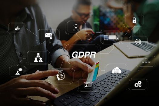 GDPR. Data Protection Regulation with Cyber security and privacy virtual diagram.Coworking process, entrepreneur team working in creative office space. using digital tablet docking keybord and laptop with smartphone.