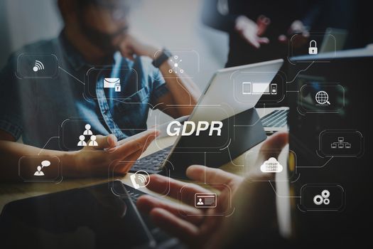 GDPR. Data Protection Regulation with Cyber security and privacy virtual diagram.StartUp Programming Team. Website designer working digital tablet dock keyboard and computer laptop with smart phone and compact server.