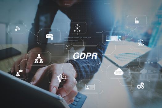 GDPR. Data Protection Regulation with Cyber security and privacy virtual diagram.Website designer working digital tablet dock keyboard and computer laptop with smart phone and graphics design diagram.