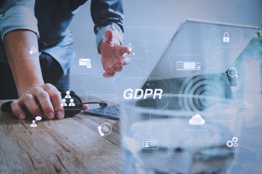 GDPR. Data Protection Regulation with Cyber security and privacy virtual diagram.Man using VOIP headset with digital tablet computer docking smart keyboard, concept communication, it support.