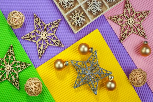 Composition of the Christmas decorations on color paper background. Christmas, winter, New Year concept. Flat lay, top view, copy space. Horizontal shot. 