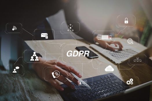 GDPR. Data Protection Regulation with Cyber security and privacy virtual diagram.Website designer working digital tablet dock keyboard and computer laptop with smart phone and graphics design diagram.