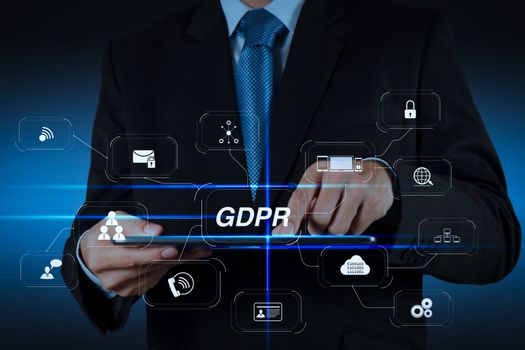 GDPR. Data Protection Regulation with Cyber security and privacy virtual diagram.businessman hand using tablet computer