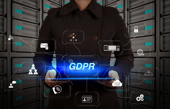 GDPR. Data Protection Regulation with Cyber security and privacy virtual diagram.tablet computer in a hands on server room
