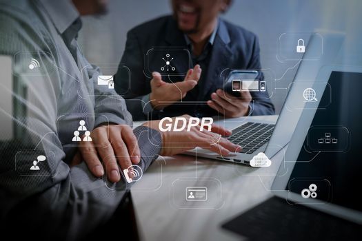 GDPR. Data Protection Regulation with Cyber security and privacy virtual diagram.Business team meeting. Photo professional investor working new start up project. Finance task.Digital tablet docking keyboard laptop computer.