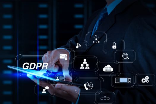 GDPR. Data Protection Regulation with Cyber security and privacy virtual diagram.businessman hand using tablet computer and server room background