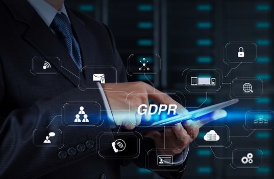 GDPR. Data Protection Regulation with Cyber security and privacy virtual diagram.businessman hand using tablet computer and server room background