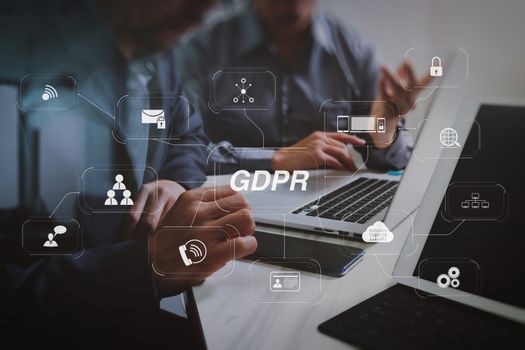 GDPR. Data Protection Regulation with Cyber security and privacy virtual diagram.Business team meeting. Photo professional investor working new start up project. Finance task.Digital tablet docking keyboard laptop computer.