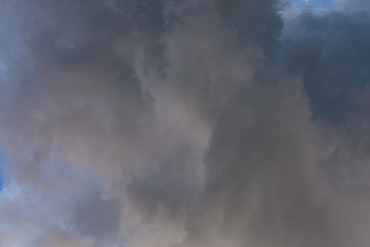 incoming storm close-up cloudscape at july daylight in continental europe.