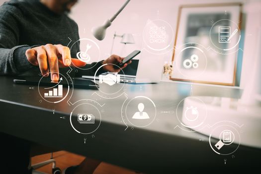 Business process management with workflow automation diagram and gears in virtual flowchart.businessman working with smart phone and digital tablet and laptop computer in modern office