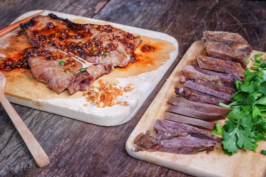 T-bone steak medium-rear steak with sliced beef on wooden background