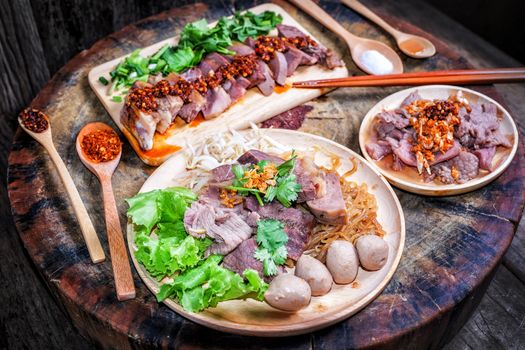 Thai food Noodle soup with beef on wood background