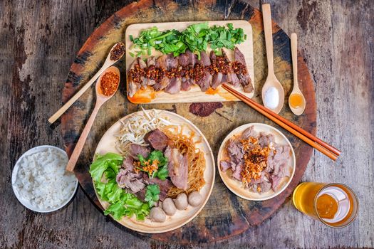 Thai food Noodle soup with beef on wood background