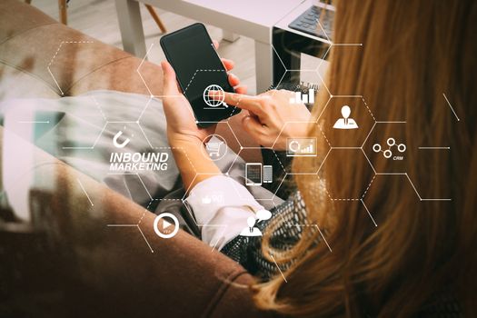 Inbound marketing business with virtual diagram dashboard and Online or permission market concept.brunette woman using smart phone and digital tablet computer on sofa in living room.