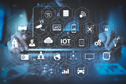 Internet of Things (IOT) technology with AR (Augmented Reality) on VR dashboard. businessman hand working with modern laptop computer in modern office with virtual icon diagram