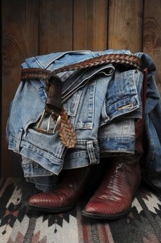 Cowboy Boots and jeans in a rustic western setting.