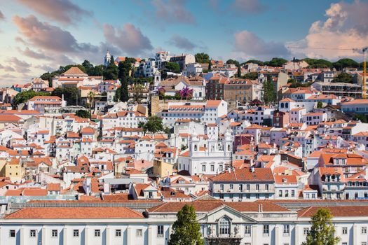 Colorful buildings and red tile rooftops on hills of Lisbon Portugal