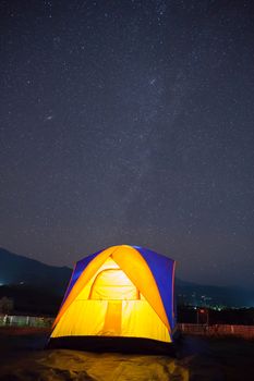 Milkyway and star with camping tent at night time