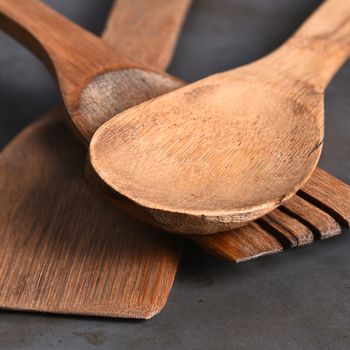 Closeup of a group of wood kitchen utensils.