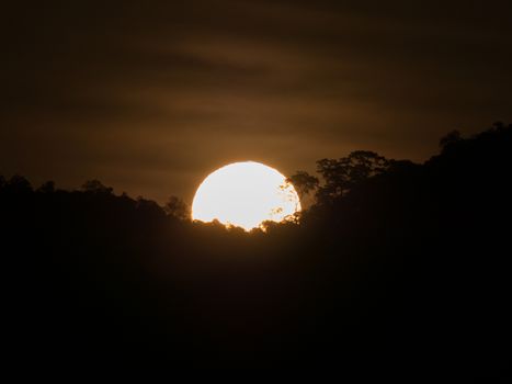 landscape view of sunrise above mountain with cloudy