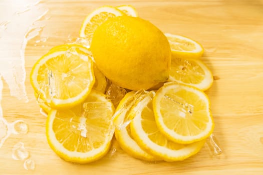 Yellow lemon Slice into pieces with ice cold 
