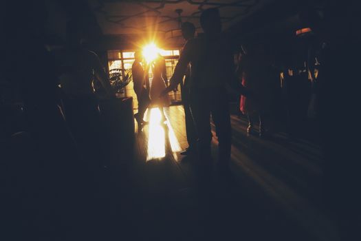 People dance at a party. Fun dancing. Silhouettes in dance. High quality photo