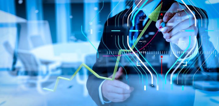 Business data analytics process management diagram.double exposure of businessman hand working with new modern computer and business strategy as concept