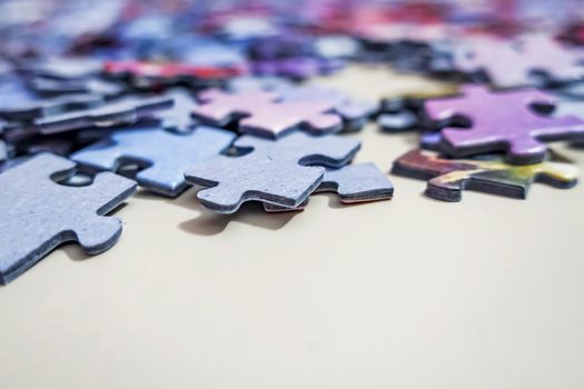 close up jigsaw puzzle pieces on background