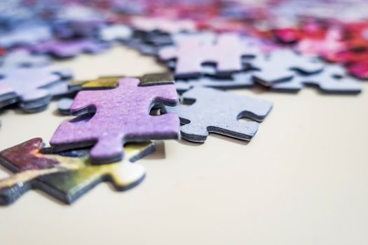 close up jigsaw puzzle pieces on background