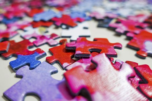 close up jigsaw puzzle pieces on background