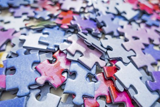 close up jigsaw puzzle pieces on background