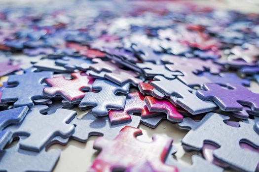 close up jigsaw puzzle pieces on background