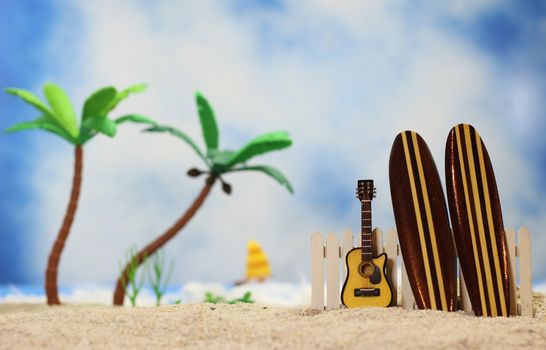 Surfboards on Tropical Beach - Shallow DOF, focus on top of guitar and fence