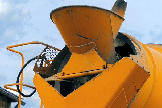 Close-up of the rear part of a concrete mixer with the filling funnel for the liquid concrete, Germany
