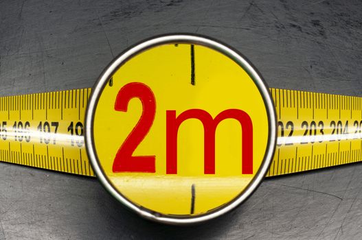 Measuring tape of two meters long due to a coronavirus pandemic social distancing rule