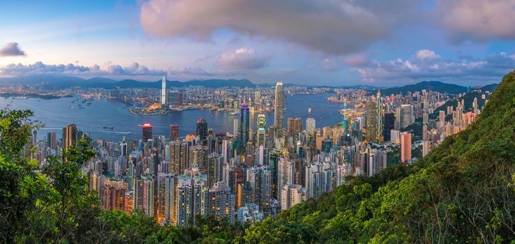 Panoramic view of Victoria Harbor and Hong Kong skyline in China at sunset