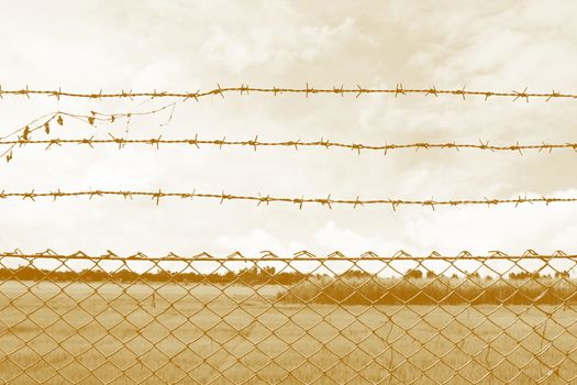 Barbed wire imprison, detention center, incarcerate, Barbed wire detention center at countryside and background sepia color style cowboy