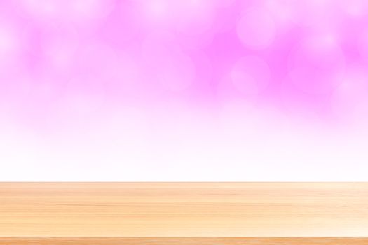 empty wood table floors on blurred bokeh soft pink white gradient background, wooden plank empty on pink bokeh colorful light shade, colorful bokeh lights gradient soft for banner advertising products