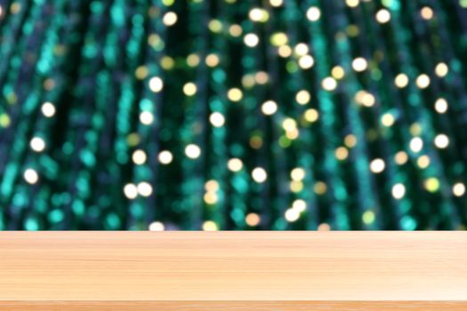 wood plank on lighting blurred christmas tree decoration background, empty wood table floors on lighting green christmas bokeh, wood table board empty front green glitter background light colorful