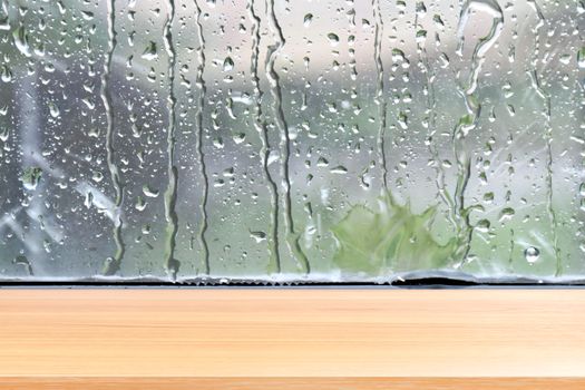 wood plank on raindrop window glass fresh background, empty wood table floors on raindrop splash background, wood table board empty on water rain fresh wall background