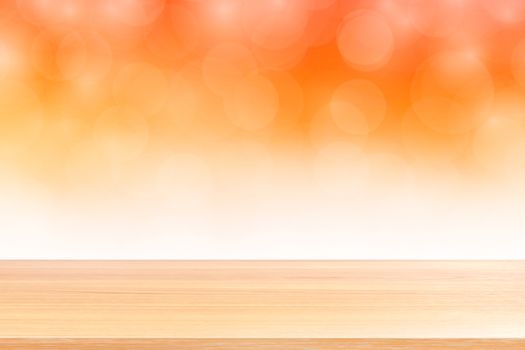 empty wood table floors on blurred bokeh soft orange white gradient background, wooden plank empty on bokeh colorful light shade, colorful bokeh lights gradient soft for banner advertising products