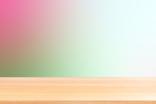 empty wood table floors on gradient pink and green soft background, wood table board empty front colorful gradient, wooden plank blank on green gradient for display products or banner advertising