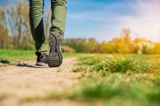 tourist walking along a hiking trail.