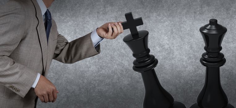 Businessman hand moving chess strategy or leadership concept