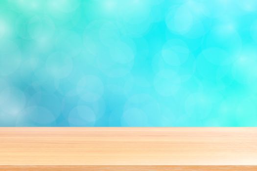 empty wood table floors on blurred bokeh soft blue gradient background, wooden plank empty on blue bokeh colorful light shade, colorful bokeh lights gradient soft for banner advertising products