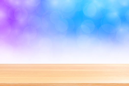 empty wood table floors on blurred bokeh soft blue white gradient background, wooden plank empty on blue bokeh colorful light shade, colorful bokeh lights gradient soft for banner advertising products