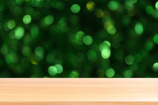 wood plank on lighting beautiful glittering green bokeh background, empty wood table floors on sunshine lighting green nature forest bokeh, wood table board empty front green glitter background light